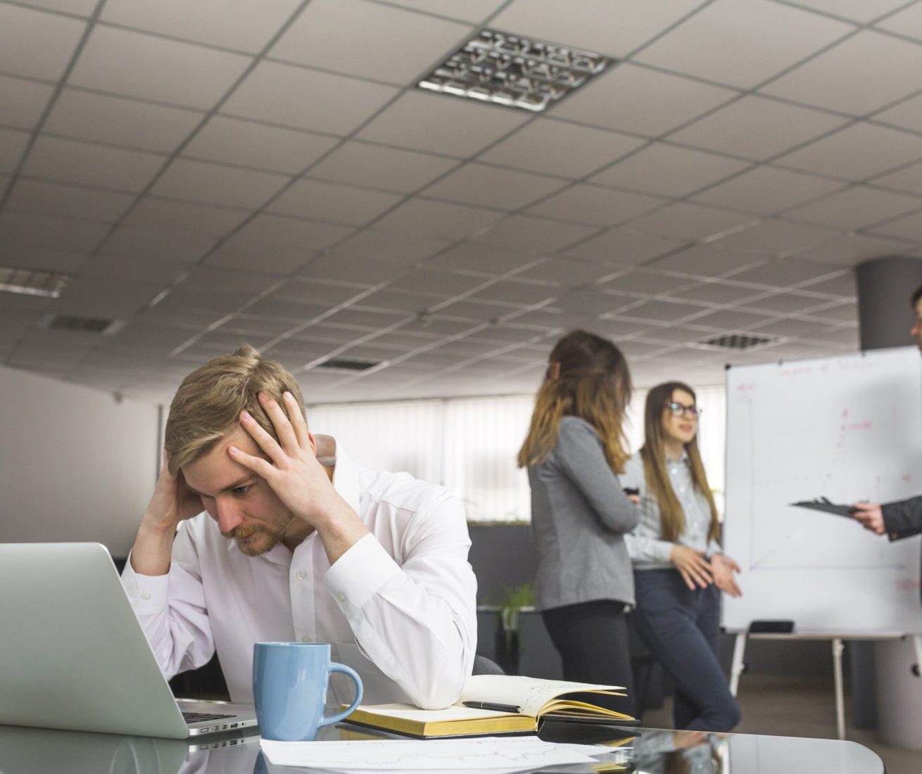 stressed-businessman-sitting-office-min stressed-businessman-sitting-office-min